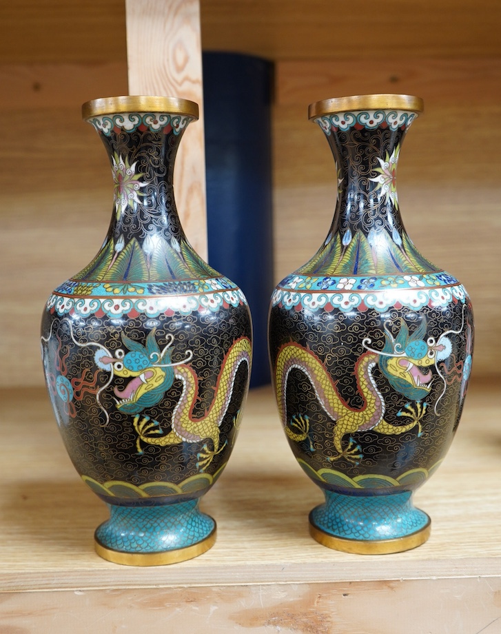 A pair of Chinese cloisonné black enamel ground vases, 23cm high. Condition - good.